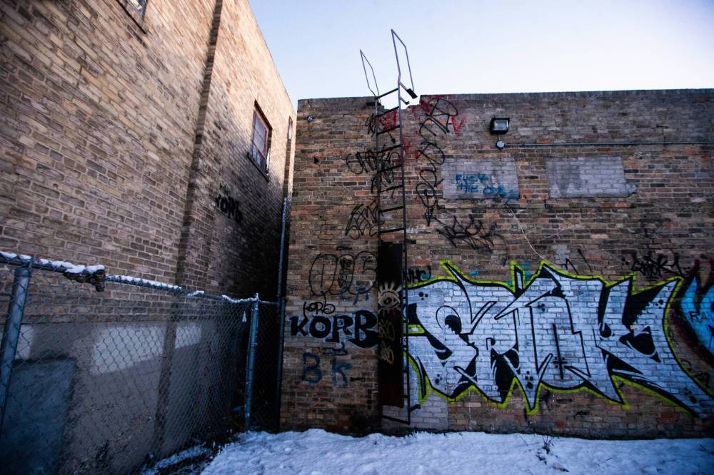 MIKAELA MACKENZIE / WINNIPEG FREE PRESS
                                The vacant building (right) beside Holy Ascension Greek Orthodox Church which has had multiple fires and a rash of break-ins.