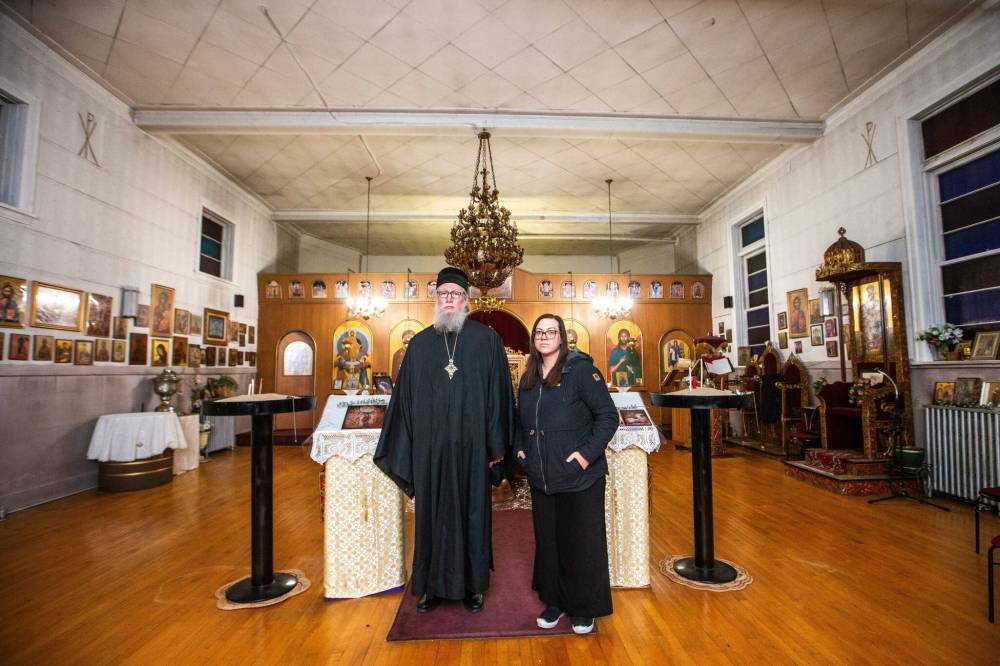 MIKAELA MACKENZIE / WINNIPEG FREE PRESS
                                Metropolitan Moses Mahany (left) and Stephanie Sarlakis, secretary of Holy Ascension Greek Orthodox Church at 197 Euclid Ave. Members of the Point Douglas church are asking themselves whether the congregation has a future in the neighbourhood.