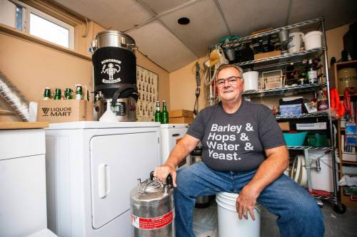 MIKAELA MACKENZIE / WINNIPEG FREE PRESS Chuck MacKenzie, home brewer who recently won a competition for a Winnipeg-inspired beer, with his brewing setup on Wednesday, Nov. 15, 2023. His winning Jeanne&rsquo;s cake-flavoured pastry stout will be released at Devil May Care Independent Brewers starting this Friday for a tasting party. For Katie story. Winnipeg Free Press 2023.