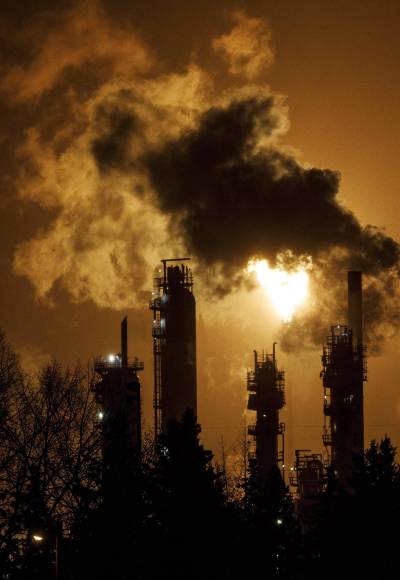 JASON FRANSON / THE CANADIAN PRESS FILES
                                A flare stack lights the sky from the Imperial Oil refinery in Edmonton on December 28, 2018. A new climate change think tank funded by the federal government says Canadians should expect to face the harsh realities of a changing climate even under the most aggressive global efforts to curb fossil fuel use and cut greenhouse gas emissions.