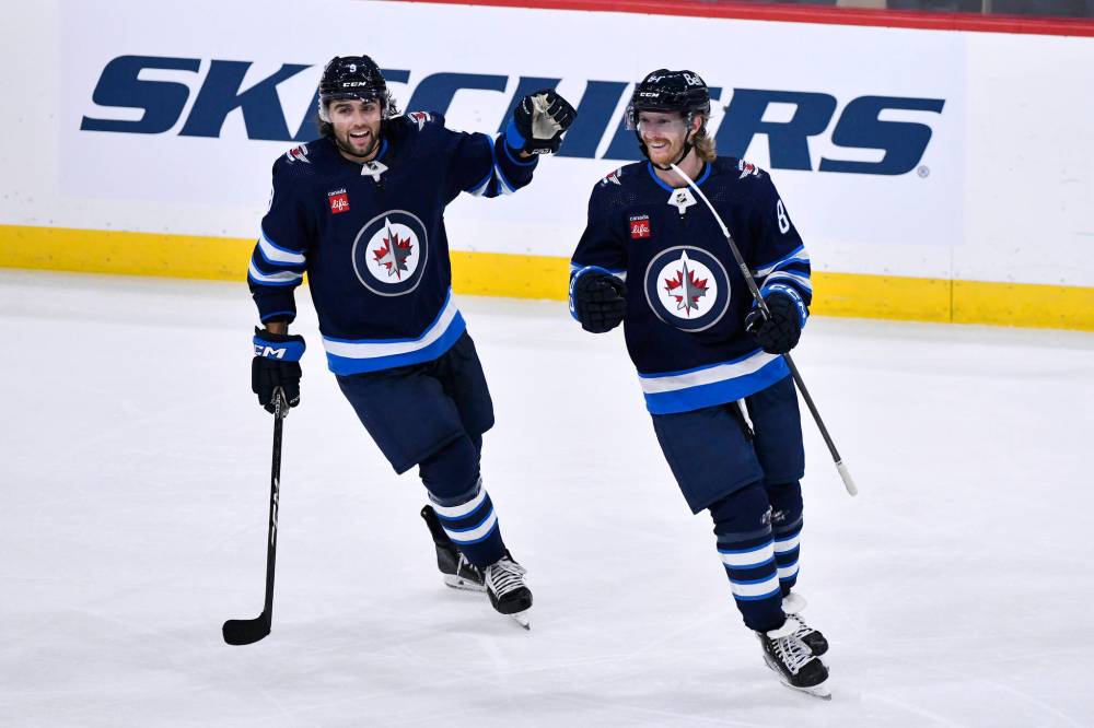 Fred Greenslade / THE CANADIAN PRESS
Alex Iafallo (left) has found chemistry with Kyle Connor (right) and Mark Scheifele on the Winnipeg Jets’ top line.