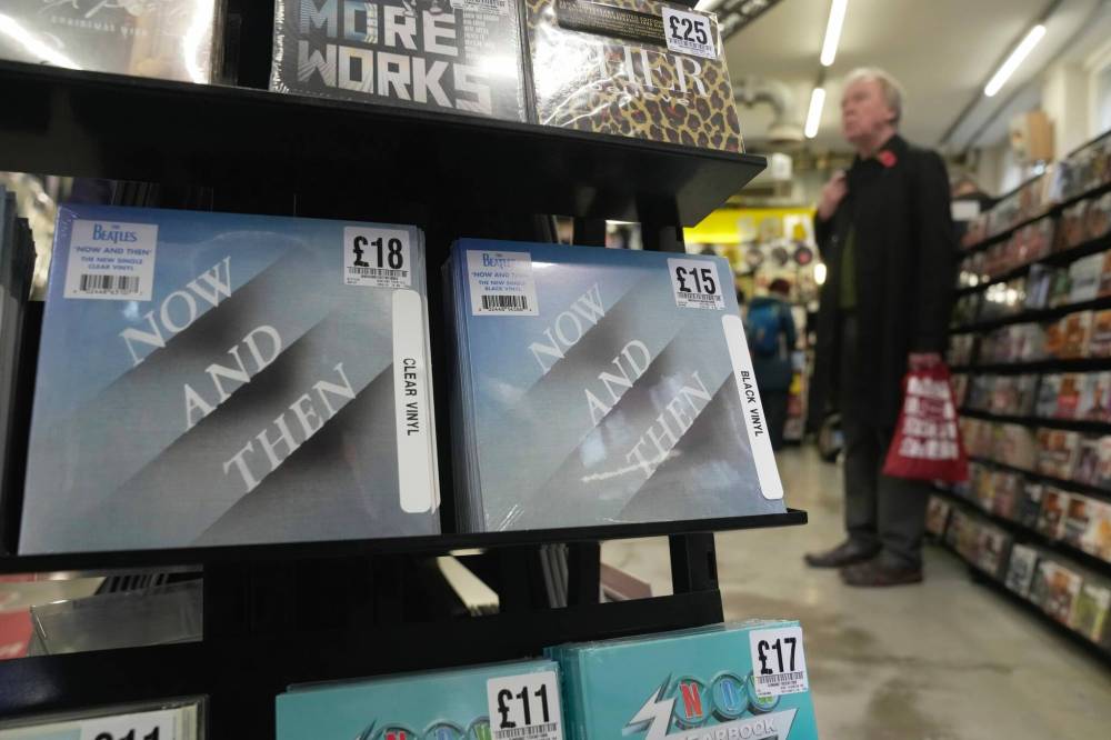 Kin Cheung / The ASSOCIATED PRESS FILES
Copies of a new Beatles single titled Now and Then on sale at a record store in London earlier this month.