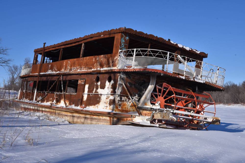 Gordon Goldsborough photo
                                In this 2022 photo, the burned-out hull of the Paddlewheel Princess sits in the Selkirk slough.