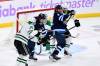 THE CANADIAN PRESS/Fred Greenslade
                                Winnipeg Jets’ Mark Scheifele, left, tries to deflect a shot on Dallas Stars goaltender Jake Oettinger as Jani Hakanpaa ties up Alex Iafallo during the first period in Winnipeg on Tuesday.