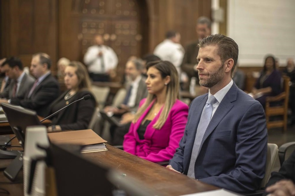 Eric Trump, son of former President Donald Trump, second from left, is seated ahead of his second day of testimony at New York State Supreme Court, Friday, Nov. 3, 2023 in New York. In a civil case brought by New York Attorney General Letitia James, members of the Trump family and the Trump Organization are accused of inflating the value of properties by billions of dollars to obtain favorable loan terms from banks. (Dave Sanders/The New York Times via AP, Pool)