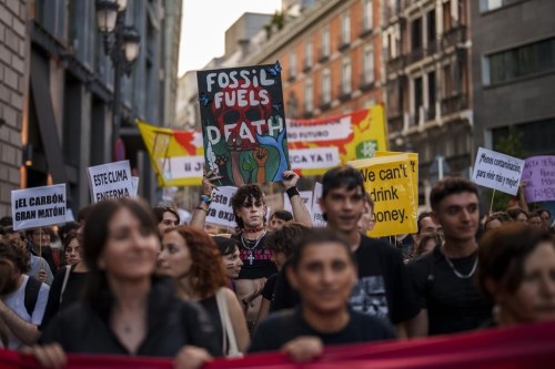 FILE - People take part in a Fridays For Future global climate protest against fossil fuel use in Madrid, Spain, Sept. 15, 2023. As United Nations leaders, scientists and others called for an eventual elimination of coal, oil and natural gas, various delegations at the COP27 climate conference were connected to those fossil fuel industries. (AP Photo/Manu Fernandez, File)