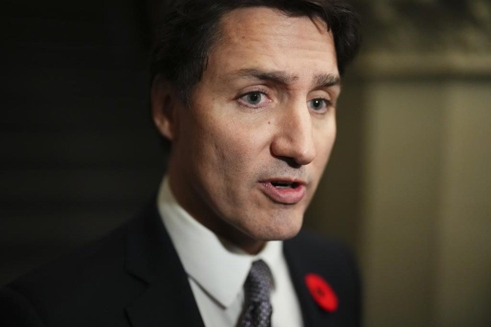 Prime Minister Justin Trudeau speaks to reporters as he arrives to a caucus meeting in Ottawa on Wednesday, Nov. 8, 2023. THE CANADIAN PRESS/Sean Kilpatrick