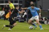 Napoli's Khvicha Kvaratskhelia, right, challenges for the ball with Union's Josip Juranovic during the Champions League, Group C, soccer match between Napoli and Union Berlin at the Diego Maradona stadium, in Naples, Italy, Wednesday, Nov. 8, 2023. (AP Photo/Gregorio Borgia)