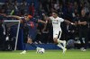 FILE - PSG's Achraf Hakimi, left, challenges for the ball with Nice's Sofiane Diop during the French League One soccer match between Paris Saint Germain and Nice at Parc des Princes stadium in Paris, on Sept. 15, 2023. World Cup semifinalist Morocco will start its qualifying campaign for the 2026 tournament with a newly recruited France Under-21 player named in the squad for the first time. Sofiane Diop is a midfielder with French league leader Nice. Diop was picked by coach Walid Regragui for scheduled games against Eritrea and Tanzania this month. (AP Photo/Michel Euler)