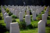 Some of the final resting places of fallen Canadians are in regions affected by armed conflict in more recent years, posing great challenges to those whose job is to preserve the gravesites. A military representative pays his respects during a Remembrance Day ceremony to honour war veterans who fought in the British Armed Forces during the World Wars at the Commonwealth War Graves Commission in the central Israeli town of Ramla, Sunday, Nov. 8, 2015. THE CANADIAN PRESS/AP/Oded Balilty