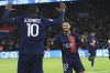 PSG's Warren Zaire-Emery, centre, celebrates with PSG's Ousmane Dembele after scoring his side's second goal during the French League One soccer match between Paris Saint Germain and Montpellier at Parc des Princes stadium in Paris, France, Friday, Oct. 3, 2023. (AP Photo/Aurelien Morissard)