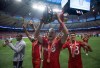 Toronto FC's Eriq Zavaleta, centre, hoists the Voyageurs Cup while celebrating with teammates goalkeeper Quillan Roberts, left, Jay Chapman, back left, and Marky Delgado, right, after defeating the Vancouver Whitecaps on aggregate in the Canadian Championship soccer final in Vancouver, B.C., on Wednesday June 29, 2016. Canada, which opens play Friday against Spain at the FIFA U-17 World Cup in Indonesia, has scored just 10 goals in its previous seven trips to the youth showcase. But one of those made history.THE CANADIAN PRESS/Darryl Dyck