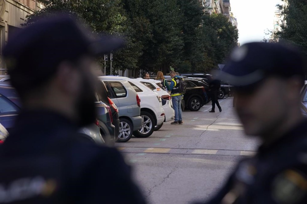 Police officers stand at the area following a shooting in Madrid, Spain, Thursday, Nov. 9, 2023. Spanish police say that veteran Spanish right-wing politician Alejandro Vidal-Quadras has been taken to a hospital in Madrid after being shot in a street in the capital. Police say he was shot in the face on a central street around 1:30 p.m. local time and was conscious when taken to a hospital. (AP Photo/Andrea Comas)
