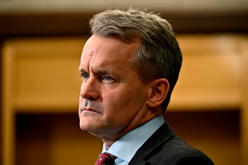 Minister of Labour Seamus O'Regan listens to a question from a reporter in the in the Foyer of the House of Commons on Parliament Hill in Ottawa, on Thursday, Oct. 19, 2023. Replacement workers will be banned during strikes and lockouts at federally regulated workplaces under new legislation introduced in the House of Commons today. THE CANADIAN PRESS/Justin Tang