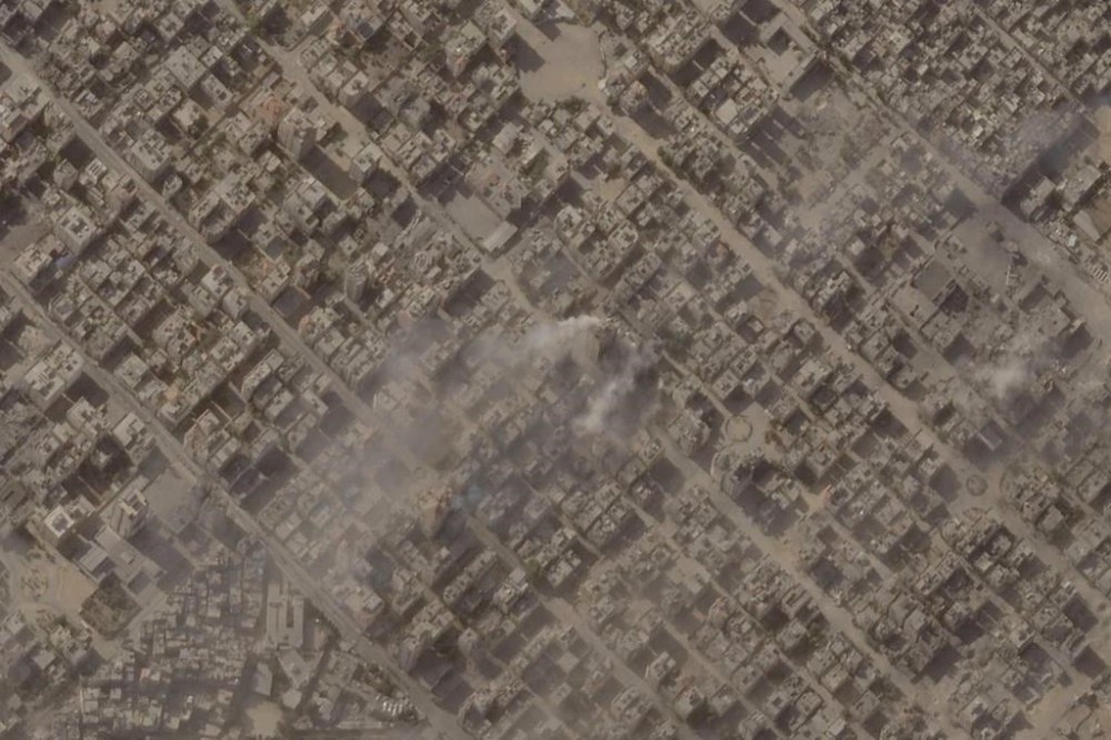 This satellite image from Planet Labs PBC shows a fire in Gaza City in the Gaza Strip on Monday, Nov. 6, 2023. Israeli troops have pushed into the Gaza Strip's largest city along a key coastal road on the Mediterranean Sea as part of their war on Hamas, satellite images from earlier this week analyzed Thursday, Nov. 9, 2023, by The Associated Press show. (Planet Labs PBC via AP)