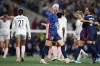 OL Reign forward Megan Rapinoe, center, reacts to a goal from teammate Veronica Latsko against Angel City FC during the second half of an NWSL quarterfinal playoff soccer match Friday, Oct. 20, 2023, in Seattle. The Reign won 1-0. (AP Photo/Lindsey Wasson)