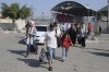 Palestinians cross to the Egyptian side of the border with the Gaza Strip Wednesday, Nov. 1, 2023. in Rafah Wednesday, Nov. 1, 2023. (AP Photo/Hatem Ali)