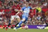 FILE - Manchester United's Victor Lindelof, left, challenges Brighton's Evan Ferguson during the English Premier League soccer match between Manchester United and Brighton and Hove Albion at Old Trafford stadium in Manchester, England, on Sept. 16, 2023. Promising young striker Evan Ferguson has extended his contract at Premier League club Brighton to June 2029. The 19-year-old Ireland international has scored five league goals this season including a hat trick in a victory over Newcastle. (AP Photo/Dave Thompson, File)