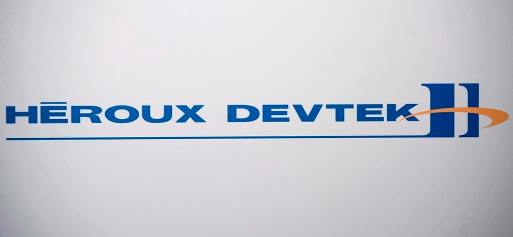 Aircraft parts maker Heroux-Devtek Inc. says it earned $4.6 million in its latest quarter, down from $4.8 million in the same quarter last year, as its revenue rose nearly seven per cent. A Heroux Devtek logo is shown at the company's annual general meeting in Montreal, Thursday, Aug. 2, 2012. THE CANADIAN PRESS/Graham Hughes