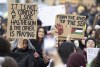 Young women hold placards during a pro-Palestinian demonstration, in Frankfurt, Germany, Friday, Nov. 3, 2023. The Jordan River is a winding, 200-plus-mile run to the east of Israel and the West Bank. The sea is the glittering Mediterranean to its west. But a phrase about the space in-between, “from the river to the sea,” has become a battle cry with new power to roil Jews and pro-Palestinian activists in the aftermath of Hamas’ murderous rampage across southern Israel Oct. 7 and Israel’s bombardment of Gaza. (Boris Roessler/dpa via AP)