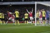 Arsenal's William Saliba, left, celebrates scoring his side's 2nd goal during the English Premier League soccer match between Arsenal and Burnley at Emirates stadium in London, England, Saturday, Nov. 11, 2023. (AP Photo/Kin Cheung)