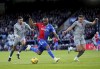 Crystal Palace's Jordan Ayew, centre, battles for the ball with Everton's Dwight McNeil, left and Vitaliy Mykolenko, during the English Premier League soccer match between Crystal Palace and Everton, at Selhurst Park, in London, Saturday, Nov. 11, 2023. (Ben Whitley/PA via AP)