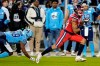 Toronto Argonauts wide receiver Cam Phillips (89) fails to stop Montreal Alouettes defensive back Kabion Ento (48) as he runs an interception back for a touchdown during second half CFL Eastern Division final football action in Toronto, Saturday, Nov. 11, 2023. THE CANADIAN PRESS/Frank Gunn