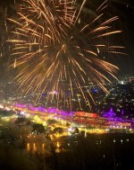 Fireworks light the sky as lamps are light up the banks of the river Saryu on the eve of the Hindu festival of Diwali, in Ayodhya, India, Saturday, Nov. 11, 2023. Ayodhya city in the northern Indian state of Uttar Pradesh Saturday set a record by lighting over 2.2 million earthen oil lamps during Deepotsav celebrations on the eve of Diwali, creating a new Guinness World Record for lighting lamps in such a large number, according to state tourism department. (AP Photo/Rajesh Kumar Singh)