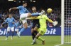 Napoli's Giovanni Simeone, top left, reaches for the ball during the Serie A soccer match between Napoli and Empoli at the Diego Armando Maradona stadium in Naples, Italy, Sunday, Nov. 12, 2023. (Alessandro Garofalo/LaPresse via AP)