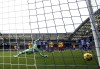 Sheffield United goalkeeper Wes Foderingham fails to stop Brighton and Hove Albion's Simon Adingra from scoring their side's first goal during the British Premier League soccer match between Brighton and Hove Albion and Sheffield United, at The AMEX, Brighton, England, Sunday Nov. 12, 2023. (Steven Paston/PA via AP)