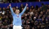 Manchester City's Erling Haaland celebrates after scoring his side's opening goal during the English Premier League soccer match between Chelsea and Manchester City at Stamford Bridge stadium in London, Sunday, Nov. 12, 2023. (John Walton/PA via AP)