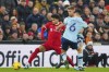 Liverpool's Luis Diaz, left, is challenged by Brentford's Christian Norgaard, front, and Kristoffer Ajer during the English Premier League soccer match between Liverpool and Brentford at Anfield stadium in Liverpool, England, Sunday, Nov. 12, 2023. (AP Photo/Jon Super)