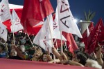 FILE - Supports of the main opposition Syriza party wave flags and chant slogans during a pre-election rally, in Athens, on Thursday, June 22, 2023. Greece’s main opposition party suffered a split Sunday when a left-wing faction announced it was breaking away and accused the party’s recently-elected leader of abandoning its ideology for a sort of “right-wing populism”. Umbrella, a faction led by Euclid Tsakalotos, a former Finance Minister during Syriza’s government of 2015-19, announced its departure with a blistering statement. (AP Photo/Petros Giannakouris, File)