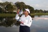 Lilia Vu, kisses the first place trophy after winning an LPGA golf tournament, Sunday, Nov. 12, 2023, in Belleair, Fla. (AP Photo/Scott Audette)