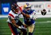 The Montreal Alouettes and Winnipeg Blue Bombers will square off in the CFL championship game, marking the first time the two franchises have ever met in the Grey Cup. Winnipeg Blue Bombers' Redha Kramdi (17) defends against Montreal Alouettes' Regis Cibasu (83) during first half CFL action in Winnipeg Thursday, August 24, 2023.  THE CANADIAN PRESS/John Woods