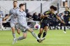 Columbus Crew forward Jacen Russell-Rowe, right, takes a shot in front of CF Montreal defender Joel Waterman during an MLS soccer match in Columbus, Ohio, Saturday, Oct. 21, 2023. Russell-Rowe has replaced the injured Lucas Cavallini in Canada's camp ahead of a high-stakes CONCACAF Nations League quarterfinal with Jamaica. THE CANADIAN PRESS/AP-Paul Vernon