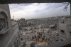 Palestinians look for survivors following an Israeli airstrike in Khan Younis, southern Gaza Strip, Sunday, Nov. 12, 2023. Scores of Canadians are still hoping to leave the Gaza Strip, as Canadians and Israelis mourn the loss of dual national Vivian Silver in last month's attack by Hamas.THE CANADIAN PRESS/AP, Fatima Shbair