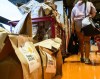 A cart is overflowing with pre-filled bags of food, during a Thanksgiving food drive for the Ottawa Food Bank at a grocery store in Ottawa, on Saturday, Oct. 7, 2023. A Statistics Canada study says nearly seven million Canadians struggled with hunger over the past 12 months.THE CANADIAN PRESS/Justin Tang