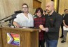 FILE - Parents Devon and Robert Dolney, of Fargo, N.D., stand with their 12-year-old child, Tate, center, during a news conference, Sept. 14, 2023, at the state Capitol in Bismarck, N.D. Tate Dolney is a transgender boy and a plaintiff in a lawsuit to block North Dakota's ban on gender-affirming care for minors. The law passed North Dakota's Republican-controlled Legislature overwhelmingly earlier this year. On Monday, Nov. 13, a North Dakota judge ruled that he won't immediately block the state's ban on gender-affirming health care for minors, delivering an early setback to the families and their pediatrician who want the new law found unconstitutional. (AP Photo/Jack Dura, File)