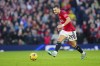 Manchester United's Diogo Dalot in action during the English Premier League soccer match between Manchester United and Luton Town at the Old Trafford stadium in Manchester, England, Saturday, Nov. 11, 2023. (AP Photo/Jon Super)
