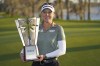Brooke Henderson holds up the championship trophy after winning the LPGA Hilton Grand Vacations Tournament of Champions, Sunday, Jan. 22, 2023, in Orlando, Fla. Henderson loves breaking records and this week she's got a dubious one hanging over her head. THE CANADIAN PRESS/AP/John Raoux