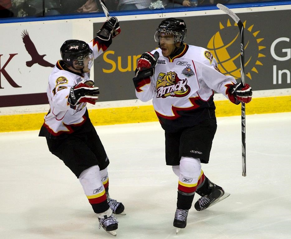Owen Sound Attack player Matt Petgrave (right) celebrates his goal with teammate Andrew Shaw after scoring on the Saint John Sea Dogs during first period Memorial Cup action in Mississauga, Ont. on Monday, May 23, 2011. Petgrave’s former general manager is coming to his defence. Petgrave is the player whose skate cut the neck of Adam Johnson last month during a professional hockey game in England. Johnson died in hospital. THE CANADIAN PRESS/Frank Gunn
