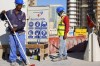 Construction cite's workers wait for trucks at a construction cite in Lusail downtown, Qatar, Thursday, Nov. 24, 2022. One year after Qatar hosted the men’s World Cup, the gas-rich emirate and soccer body FIFA have been urged by human rights group group Amnesty International on Thursday, Nov. 16, 2023 to do more for migrant workers. The workers' labor in mostly searing heat was essential to prepare stadiums, transport routes and hotels for the month-long tournament. (AP Photo/Pavel Golovkin, file)