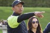 FILE - Tiger Woods, left, and Erica Herman appear on the 18th green during the JP McManus Pro-Am at Adare Manor, Limerick, Ireland, July, 4, 2022. Herman, the ex-girlfriend of golf superstar Woods, has dropped her $30 million lawsuit against the trust that owns his $54 million Florida mansion. (AP Photo/Peter Morrison, File)