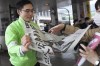 A staff distributes an extra edition of the Yomiuri Shimbun newspaper reporting on Los Angeles Angels' Shohei Ohtani winning the Major League Baseball's American League MVP Friday, Nov. 17, 2023, in Tokyo. The headline of the newspaper says in Japanese 