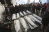 Palestinians mourn over the bodies of relatives killed in the Israeli bombardment of the Gaza Strip in Rafah on Friday, Nov. 17, 2023. (AP Photo/Hatem Ali)