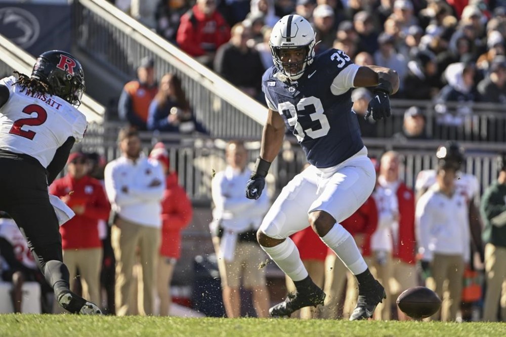 Penn State defensive end Dani Dennis-Sutton (33) looks at fumble by Rutgers quarterback Gavin Wimsatt (2) during the first half of an NCAA college football game, Saturday, Nov.18, 2023, in State College, Pa. (AP Photo/Barry Reeger)