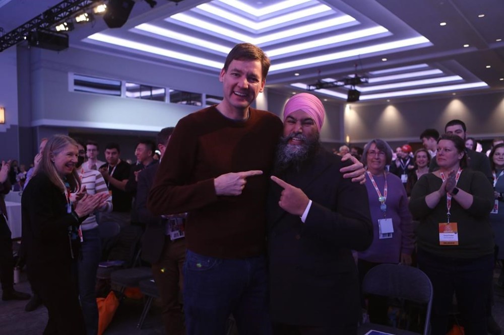 B.C. Premier David Eby and federal New Democrat leader Jagmeet Singh gesture as they join delegates on the final day of the B.C. NDP convention at the Victoria Conference Centre in Victoria, B.C., on Sunday, November 19, 2023. THE CANADIAN PRESS/Chad Hipolito