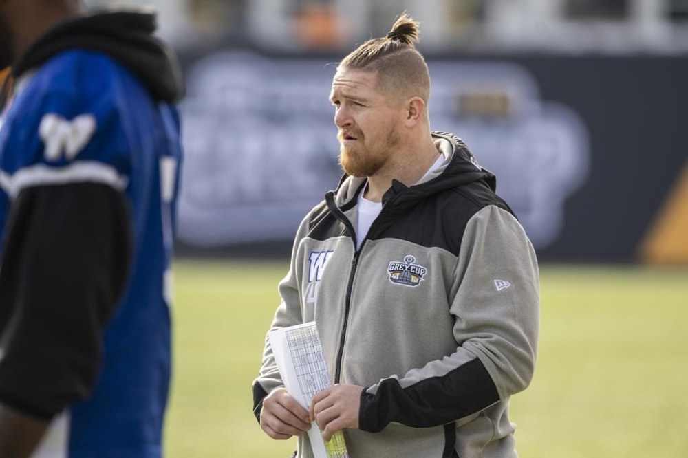 Injured Winnipeg Blue Bombers linebacker Adam Bighill watches on the sidelines during practice in Hamilton, Ont., Thursday, Nov. 16, 2023. Linebacker Bighill and receiver Dalton Schoen both dressed for the Winnipeg Blue Bombers in the Grey Cup. THE CANADIAN PRESS/Nick Iwanyshyn