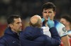 England's Harry Maguire is checked by physio after taking a knock to the head during the Euro 2024 group C qualifying soccer match between North Macedonia and England at National Arena Todor Proeski in Skopje, North Macedonia, Monday, Nov. 20, 2023. (AP Photo/Darko Vojinovic)